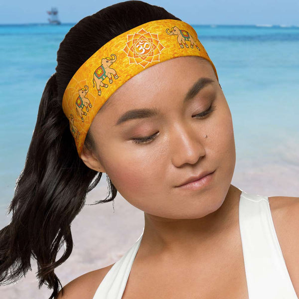 Marching Elephants Headband with a lotus and om sign in the center. Designer, Sushila Oliphant with Apparel for the Spirit.