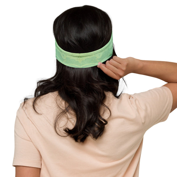 Jade Buddha headband great for yoga classes and gym workouts. Om signs and lotus petals embedded in the design. Artist, Sushila Oliphant with Apparel for the Spirit.