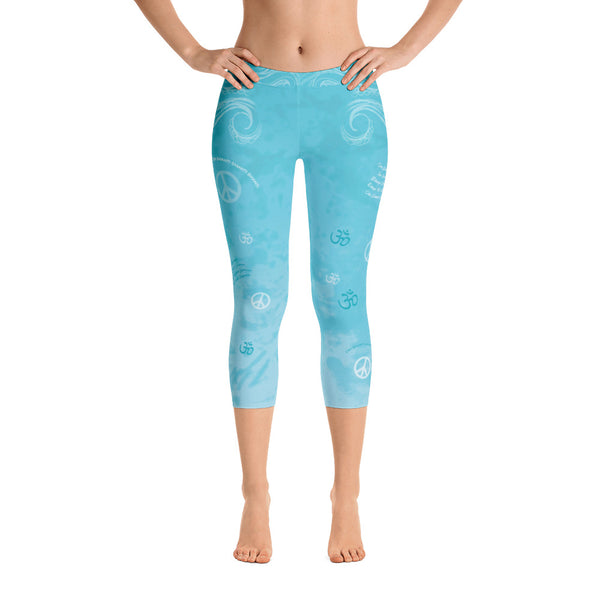 Om Shanti sky blue capri leggings with om signs, peace signs, mantras and stylized art. Great for yoga and gym workouts! Designed by Sushila Oliphant, Apparel for the Spirit.