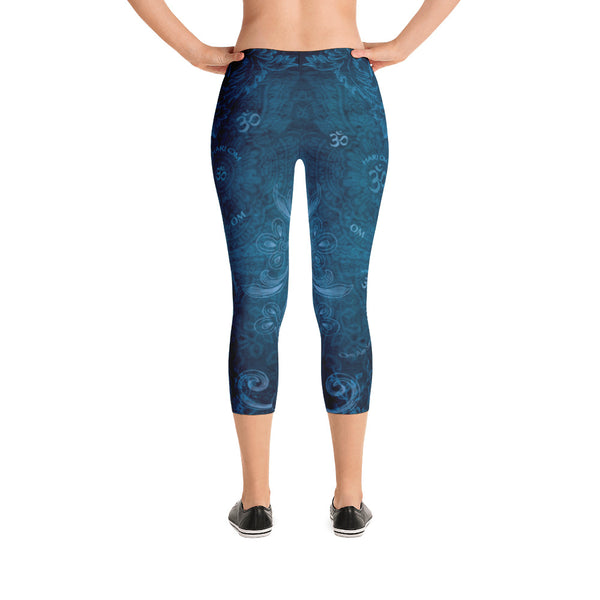 Saraswati indigo capri leggings with om signs, mantras and stylized lotus petals. Great for yoga and gym workouts! Designed by Sushila Oliphant, Apparel for the Spirit.