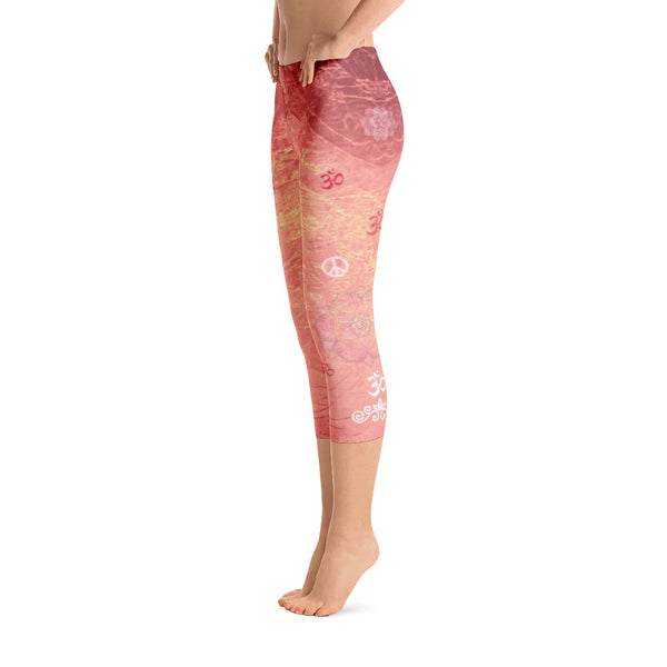 Sunrise colored capri leggings, dotted with lotuses, om signs and peace signs and great for yoga and gym workouts! Designed by Sushila Oliphant, Apparel for the Spirit.