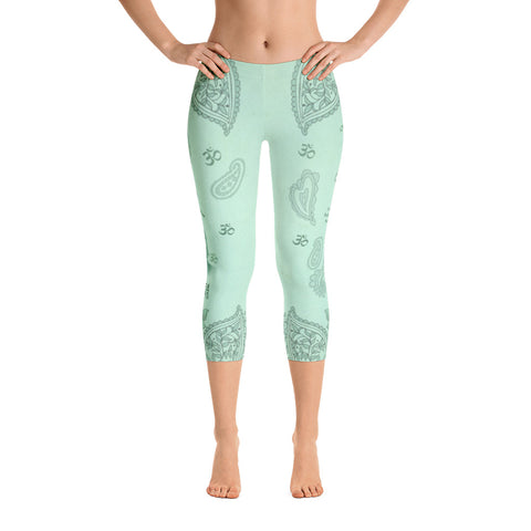 Jade green Buddha capri leggings with om signs, mantras and stylised lotus petals. Great for yoga and gym workouts! Designed by Sushila Oliphant, Apparel for the Spirit.
