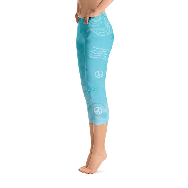 Om Shanti sky blue capri leggings with om signs, peace signs, mantras and stylized art. Great for yoga and gym workouts! Designed by Sushila Oliphant, Apparel for the Spirit.