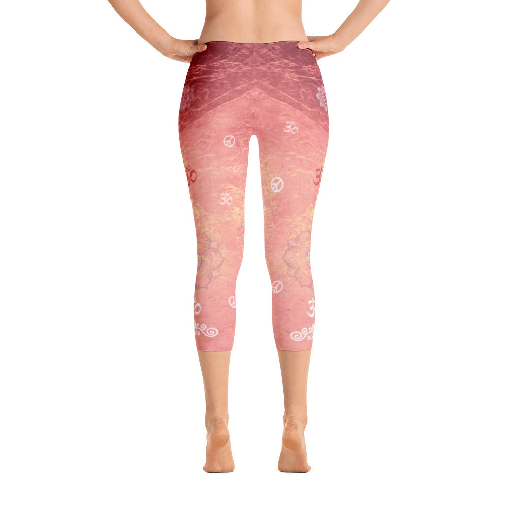 Sunrise colored capri leggings, dotted with lotuses, om signs and peace signs and great for yoga and gym workouts! Designed by Sushila Oliphant, Apparel for the Spirit.