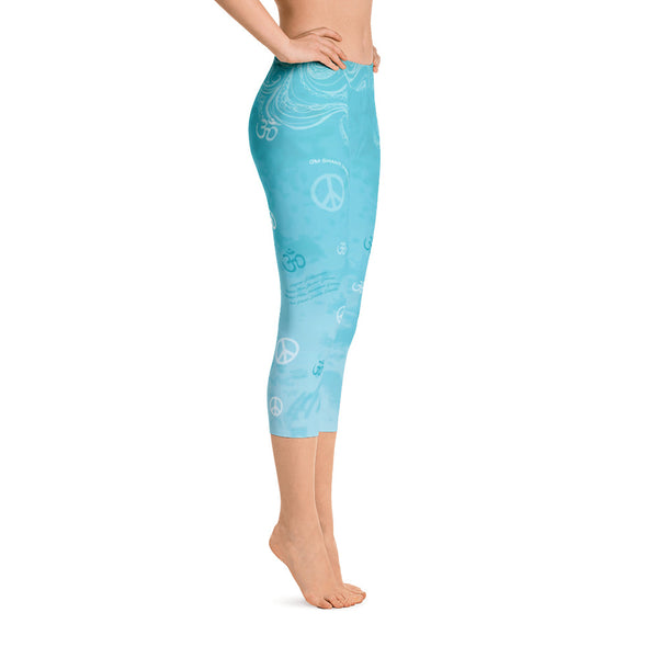 Om Shanti sky blue capri leggings with om signs, peace signs, mantras and stylized art. Great for yoga and gym workouts! Designed by Sushila Oliphant, Apparel for the Spirit.