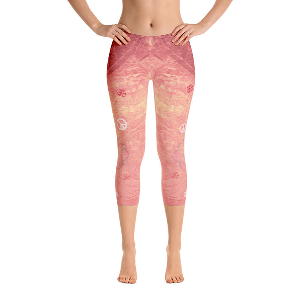 Sunrise colored capri leggings, dotted with lotuses, om signs and peace signs and great for yoga and gym workouts! Designed by Sushila Oliphant, Apparel for the Spirit.